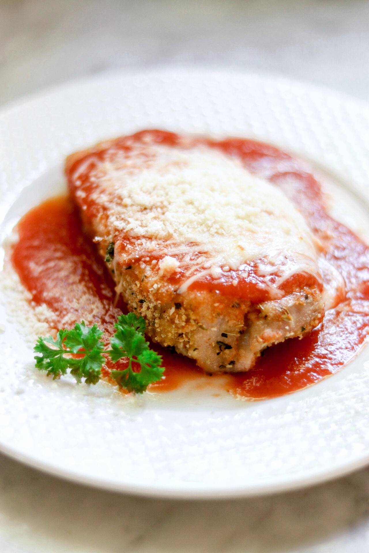 <p>Chicken Parm is a favorite Italian dinner any day of the week, but if your family wants it Monday through Friday, you probably don't have the time to pound, coat, and fry the cutlets. So instead, use this make-ahead version that lets you get it on the table faster.</p>
                          <p>But if you're just looking for a great chicken Parmesan restaurant, one reviewer says it's great the first time you cook it, too: "This is so easy and taste better than the Chicken Parmesan at Olive Garden!! I didn't make it ahead, just did it all at once. We did fettuccine noodles with it and it is a definite make again soon from family!" writes Tina O'Neal.</p>
                          