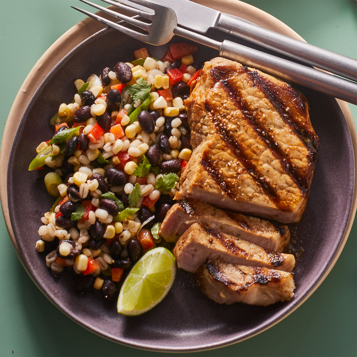 <p>This hearty bean salad is packed with vibrant colors and contrasting textures. Center-cut boneless pork chops (also called pork cutlets), make a convenient and economical protein to round out the meal. This recipe makes one extra cutlet, which can be refrigerated for another use (see Associated Recipe).</p>
                          