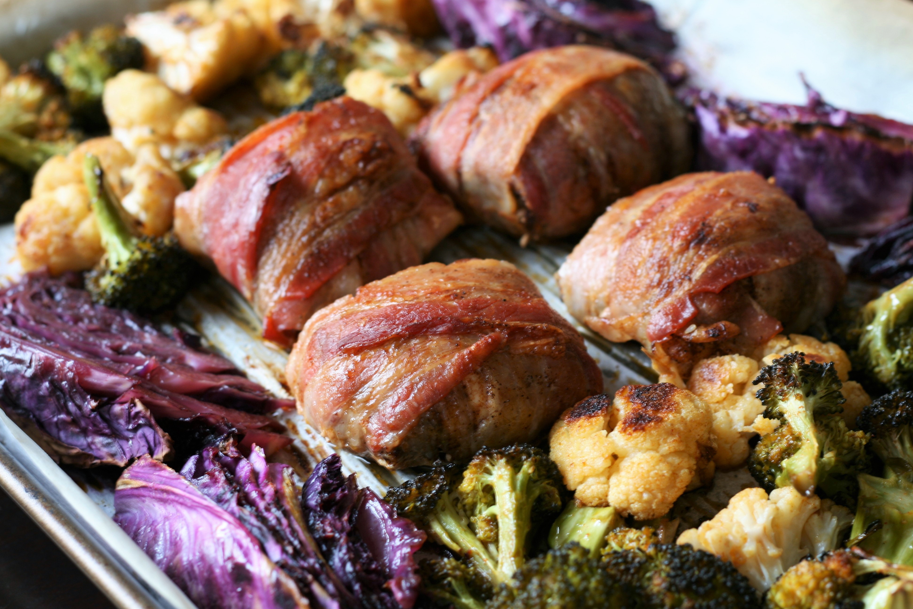 This might be a keto-friendly recipe, but even if you aren't keto you'll still love this dish. Lots of veggies combine with chicken thighs, bacon, and spices for a sheet pan dinner that's full of flavor.
                          