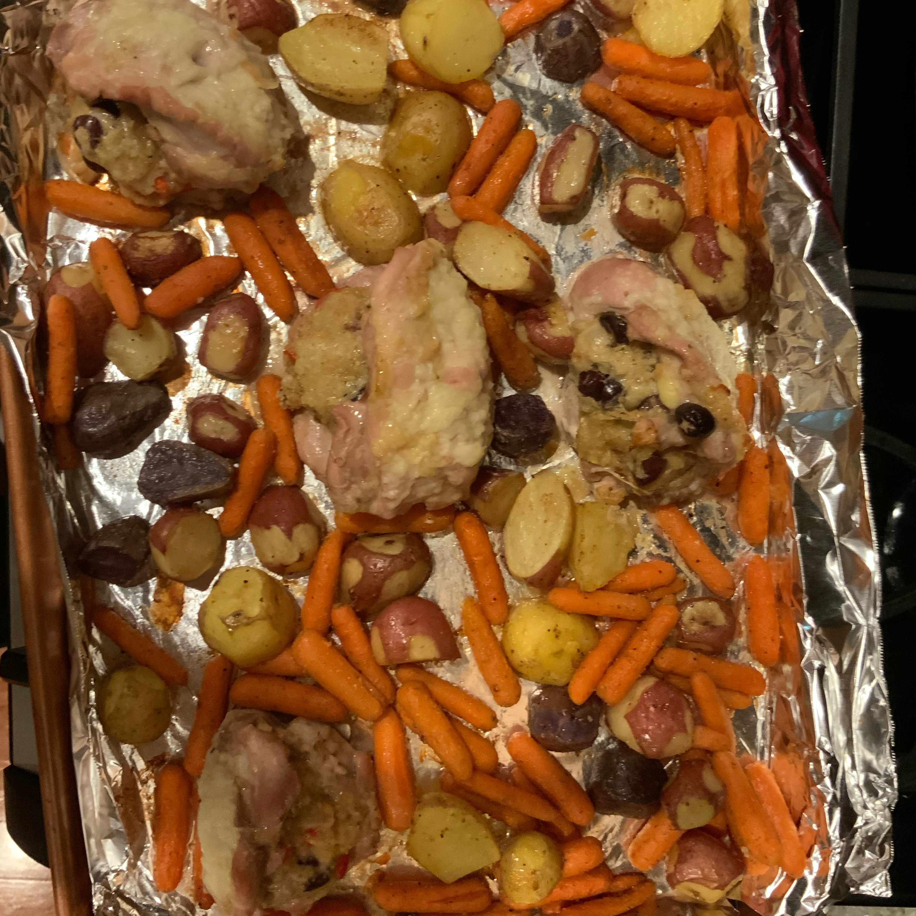 Stuffed Chicken Thighs with Roasted Potatoes and Carrots 