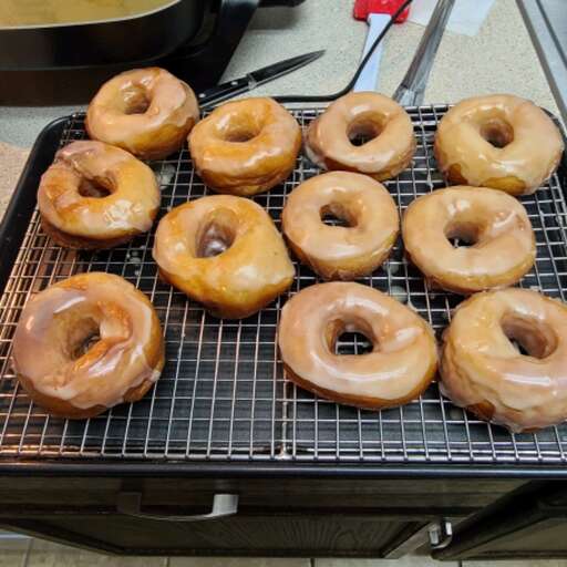 No Homemade Krispy Kreme is complete without its signature glaze – a veil of sweetness that cloaks each doughnut in a shiny, irresistible finish. The glaze, a simple harmony of powd