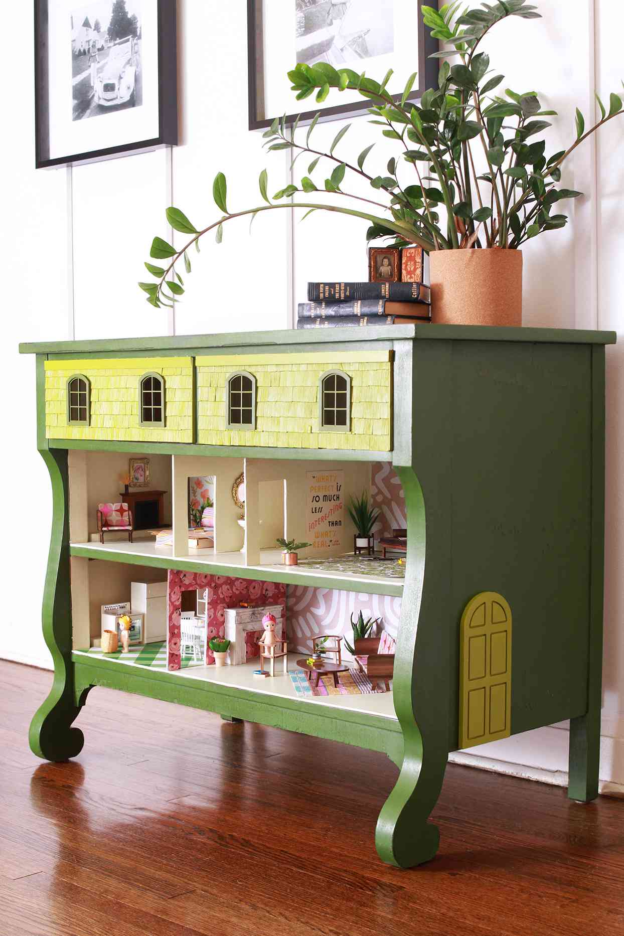 green dresser with dollhouse inside