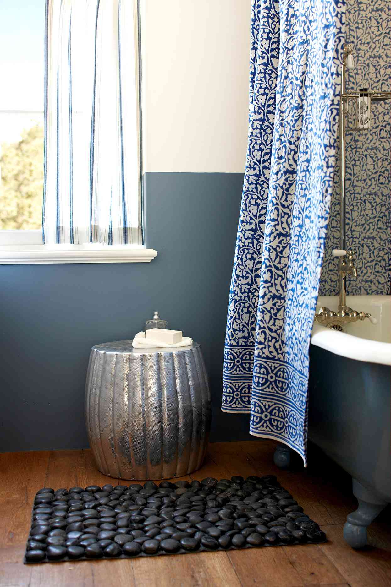 Bathroom with dark blue claw foot tub