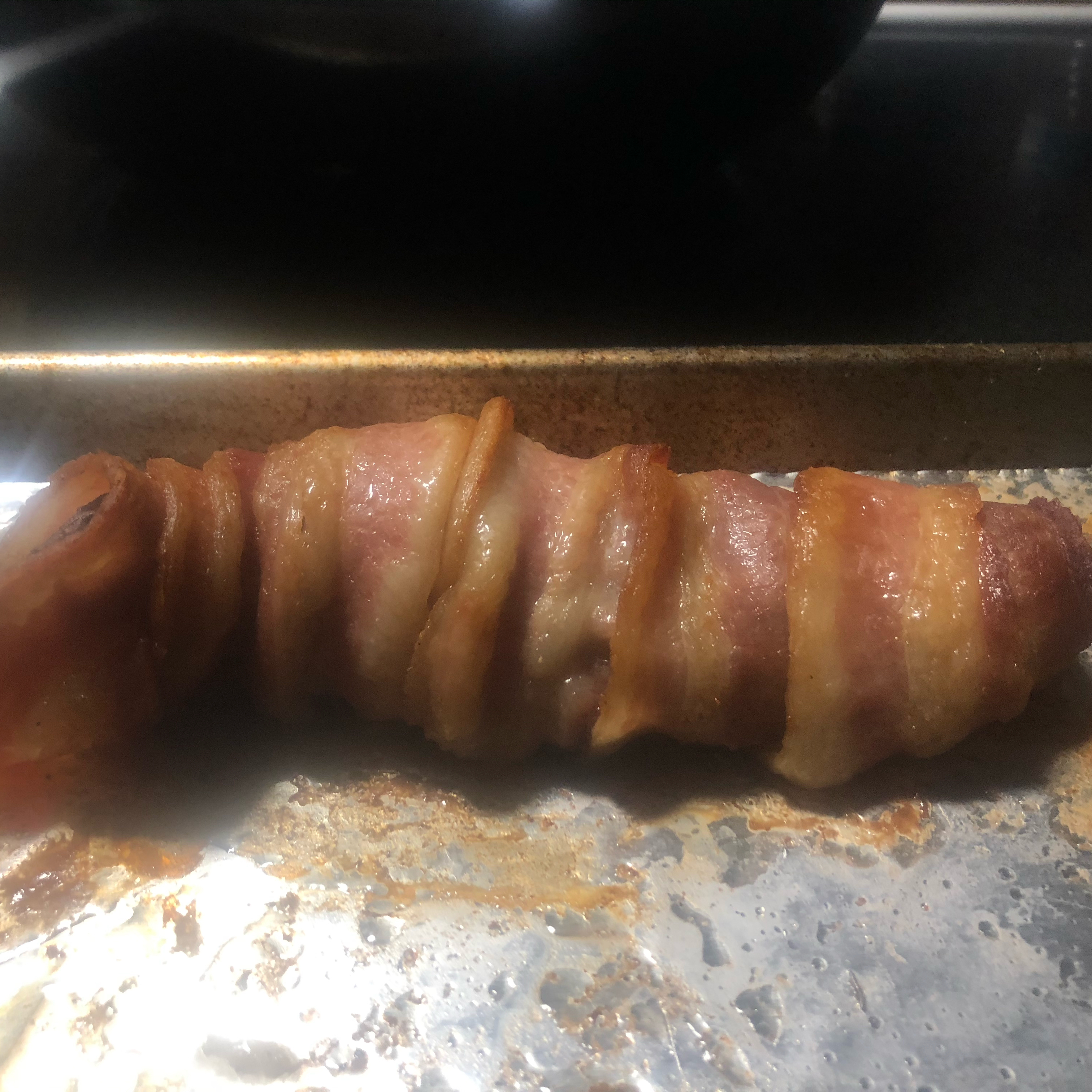 Bacon-Wrapped Venison Tenderloin with Garlic Cream Sauce 
