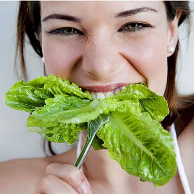 woman-biting-lettuce