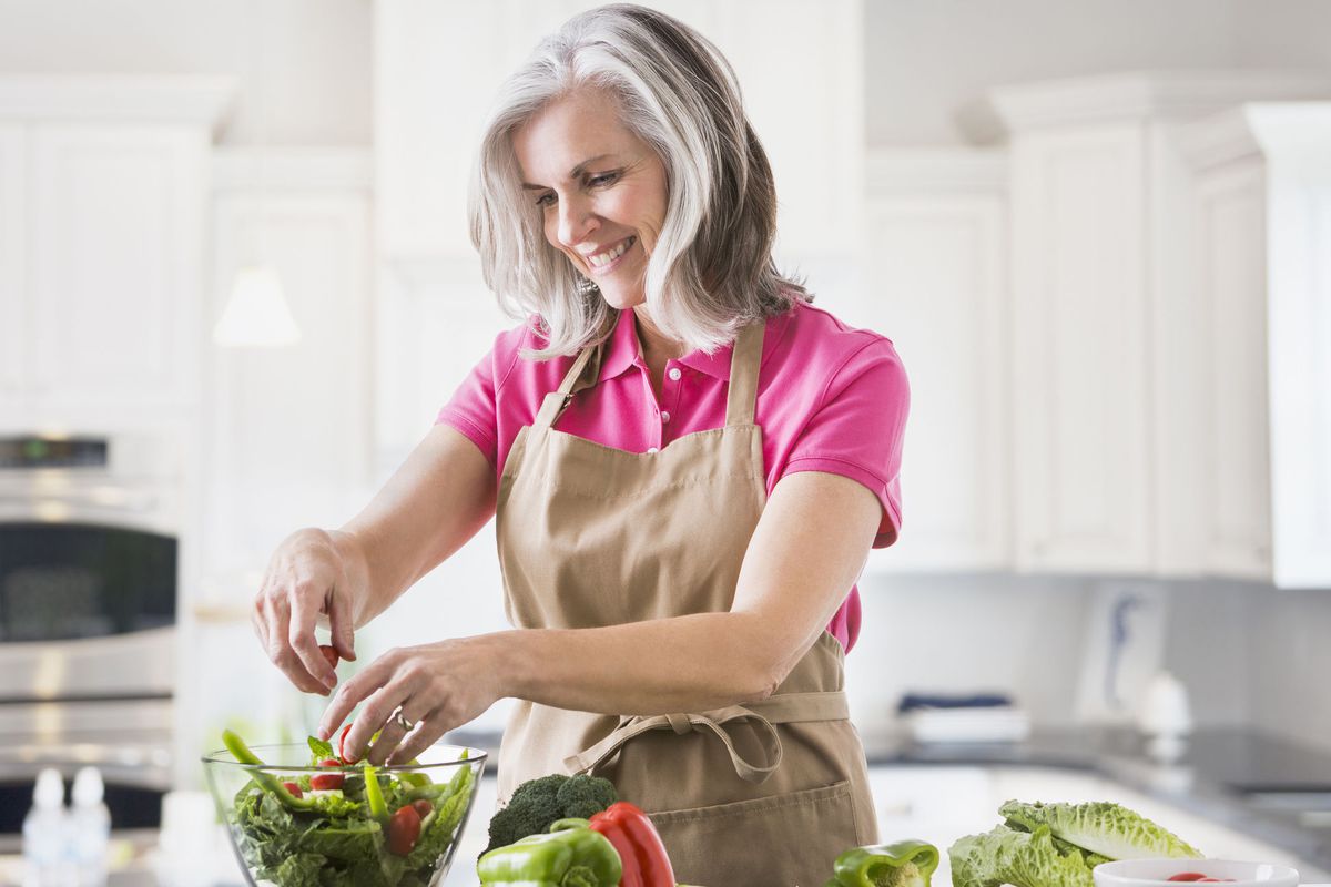 Woman Preparing Salad in Kitchen