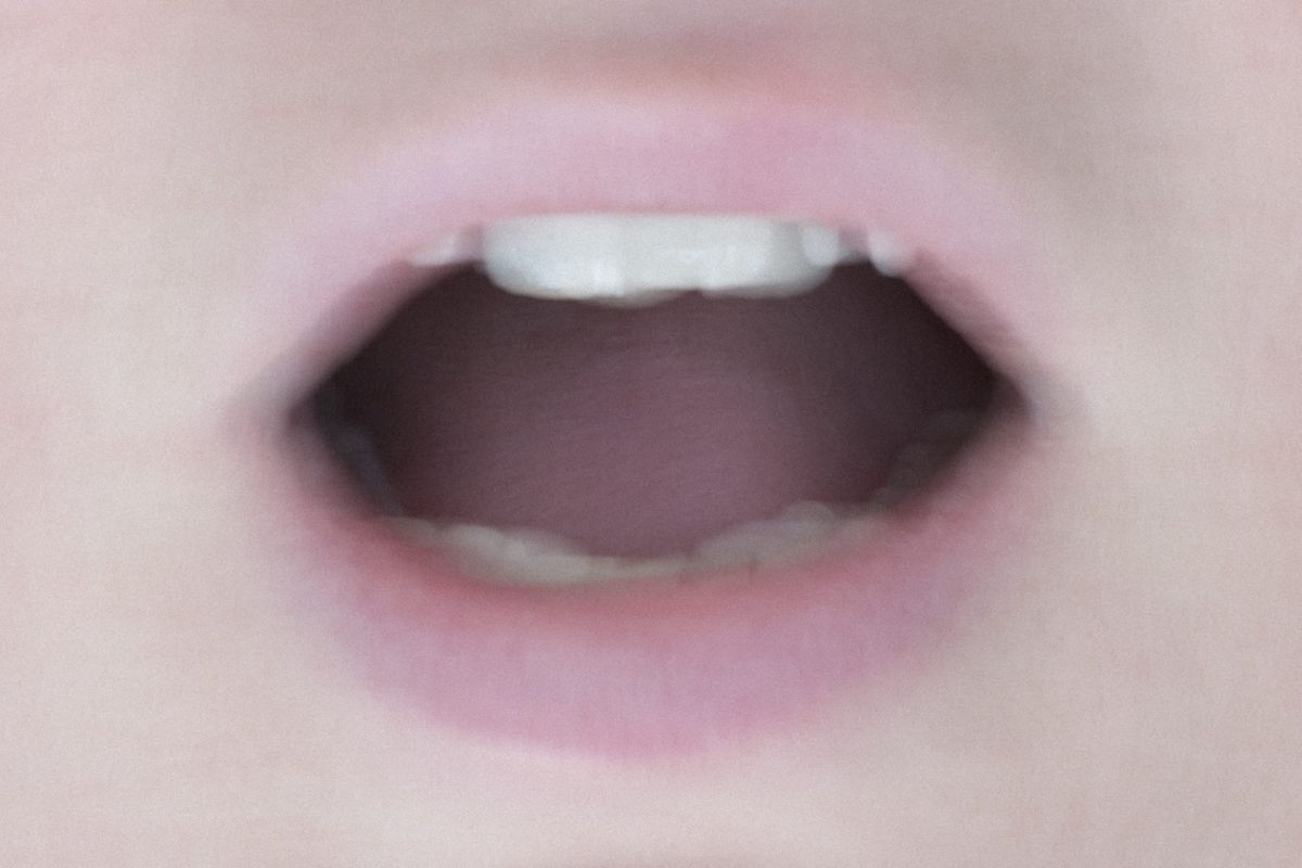 Close up of womans mouth opened