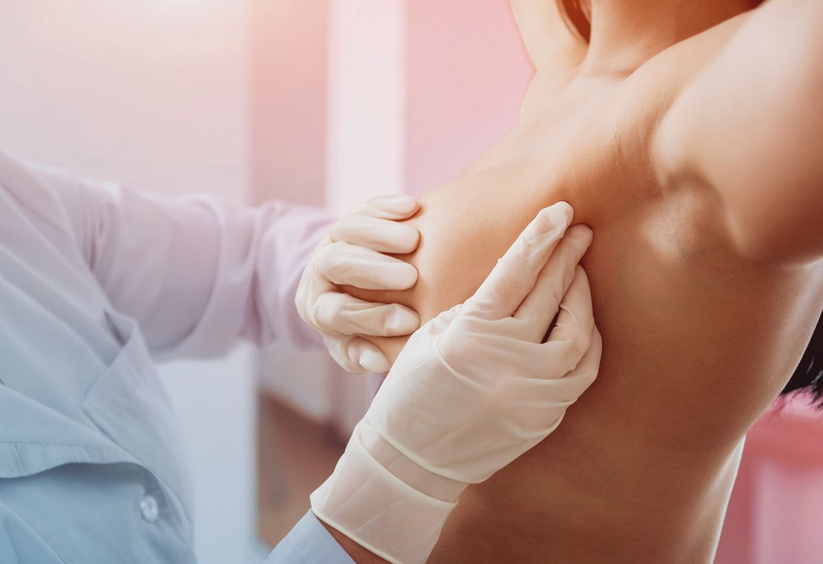 Doctor get examining breast of young woman. Consultation with gynecologist. , breast-cancer-misdiagnosed