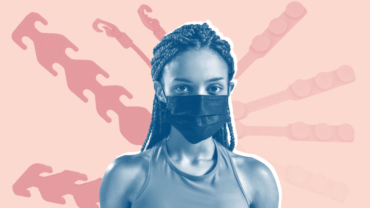 protective mask extender , Portrait of a young sportive mixed race woman wearing black medical protective face mask looking at camera while standing isolated over grey background. Health, sports, quarantine and covid 19 concept
