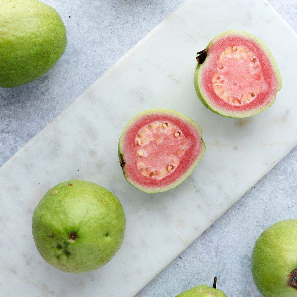 Fresh ripe guava on marble background