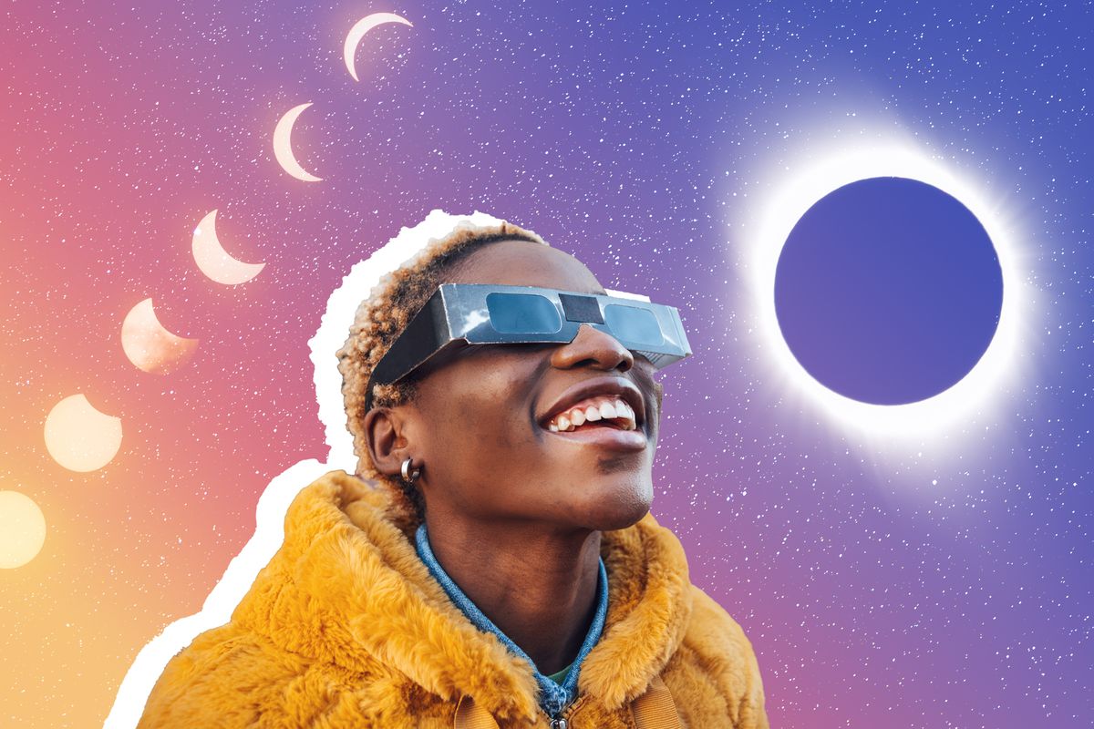 solar eclipse , Teenage girl looking at solar eclipse wearing the proper protective eyeglasses