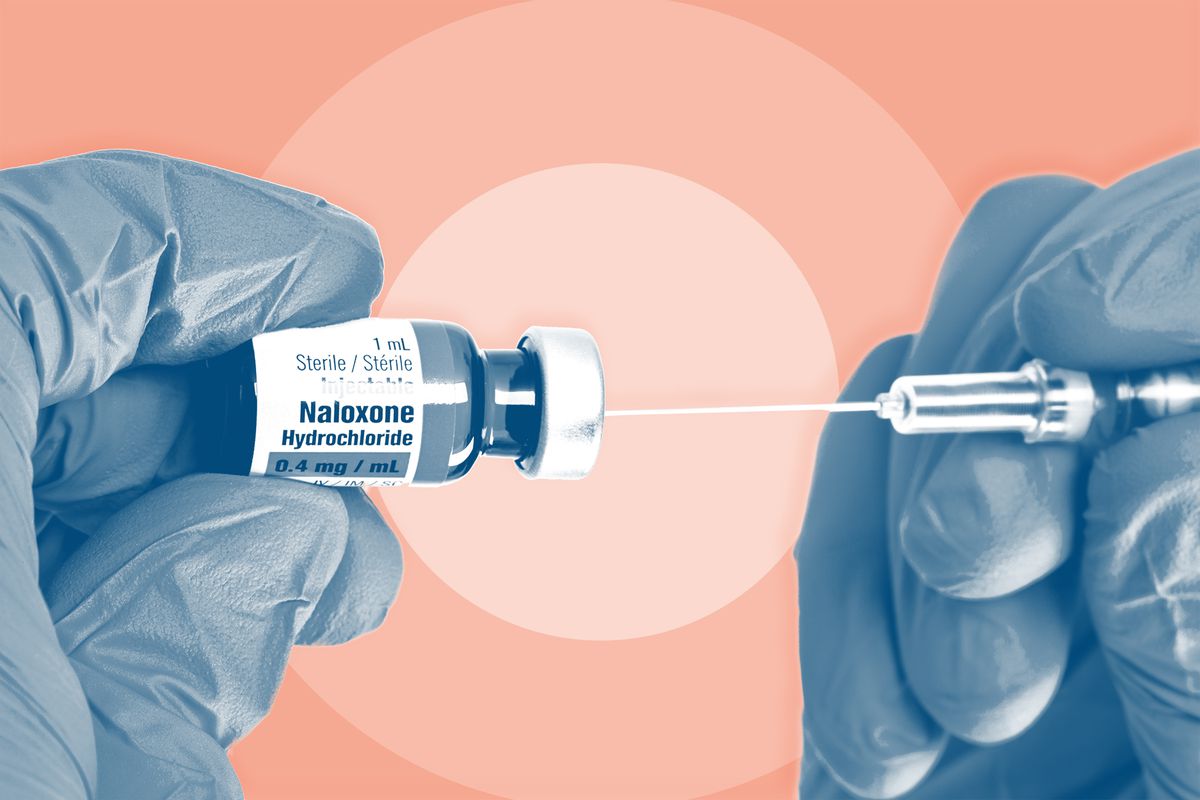 opioid antagonist Naloxene Narcan , Hands Holding Syringe and Naloxone Opioid Overdose Medication
