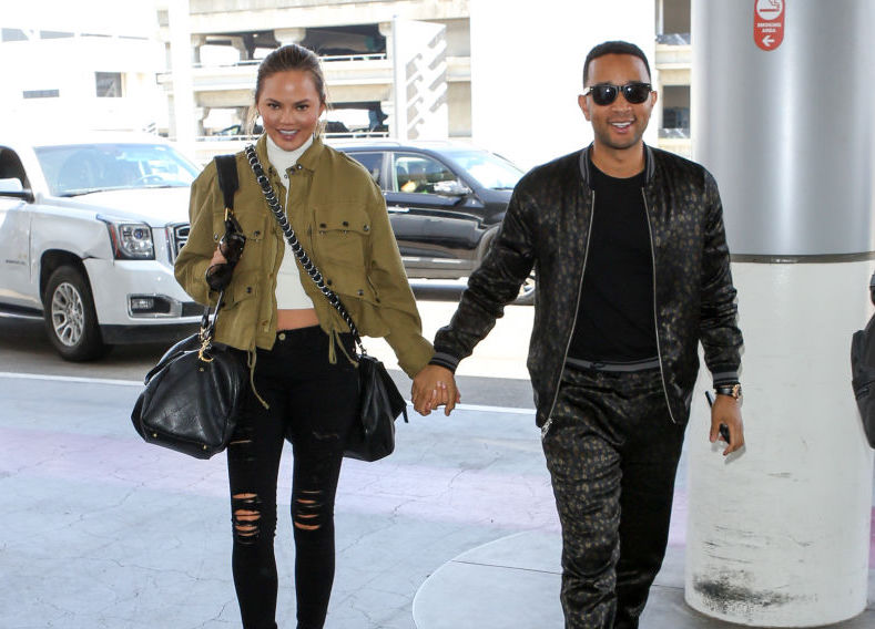 LOS ANGELES, CA - AUGUST 24: Chrissy Teigen and John Legend are seen at LAX on August 24, 2017 in Los Angeles, California.