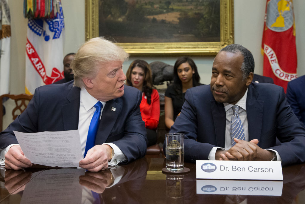 WASHINGTON, DC - FEBRUARY 1: (AFP OUT) President Donald Trump (L), holds an African American History Month listening session attended by nominee to lead the Department of Housing and Urban Development (HUD) Ben Carson (R) and other officials in the Roosevelt Room of the White House on February 1, 2017 in Washington, DC. (Photo by Michael Reynolds - Pool/Getty Images)