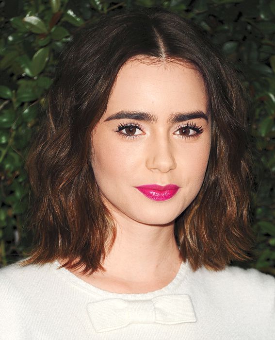 Lily Collins attends the Chanel and Charles Finch pre-Oscar dinner