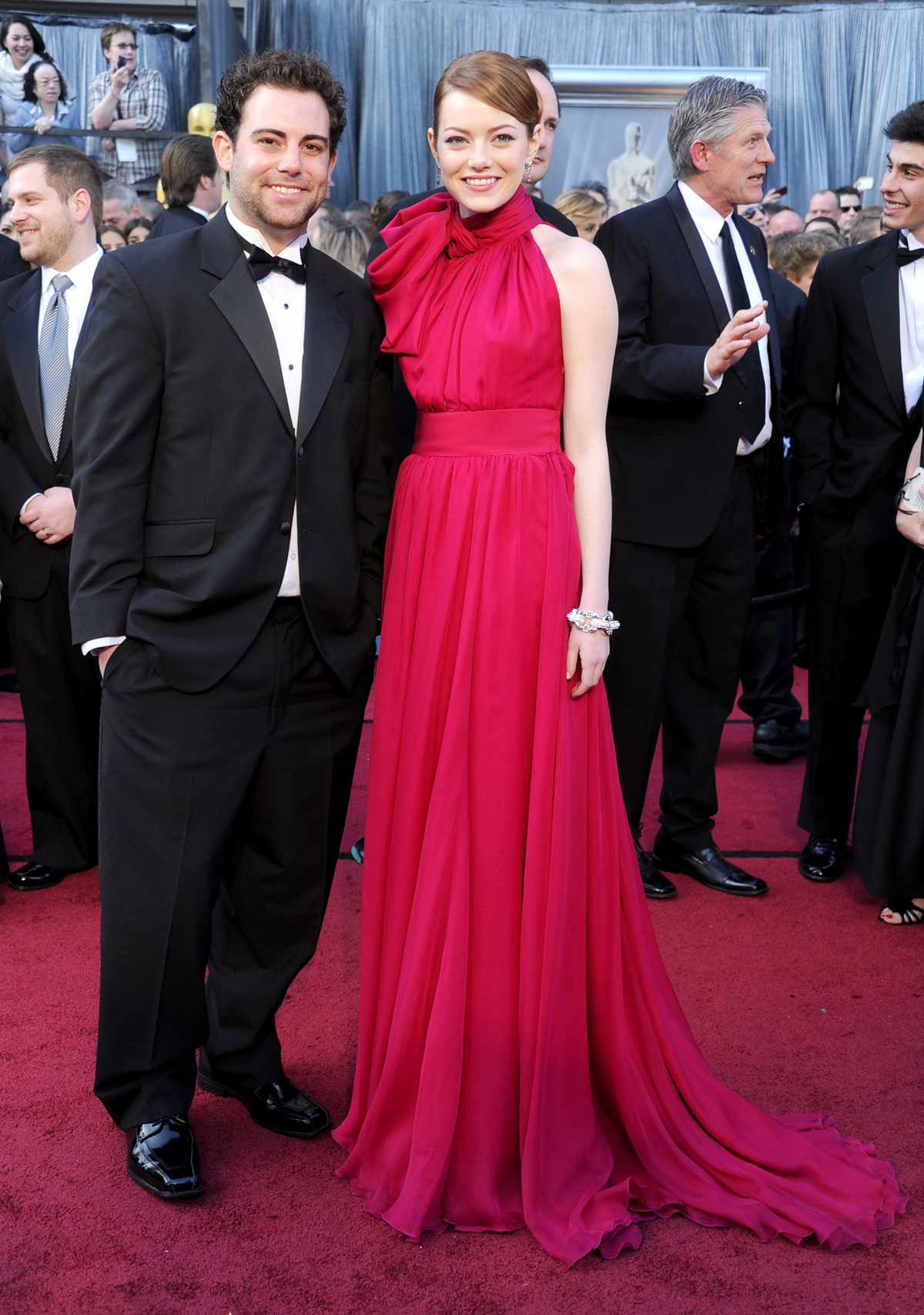 Actress Emma Stone (R) and brother Spencer Stone arrive at the 84th Annual Academy Awards at Hollywood & Highland Center on February 26, 2012 in Hollywood, California.