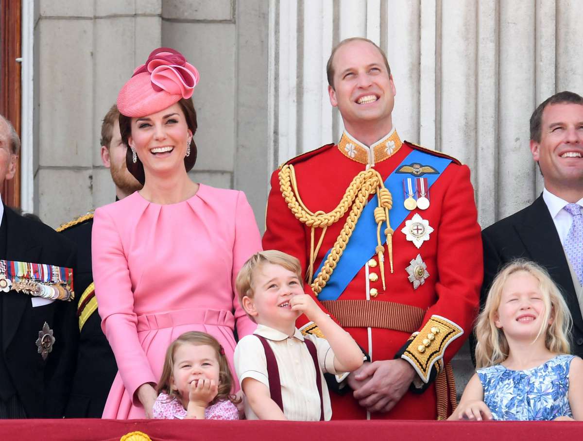 The family laughs at the annual Trooping the Colour