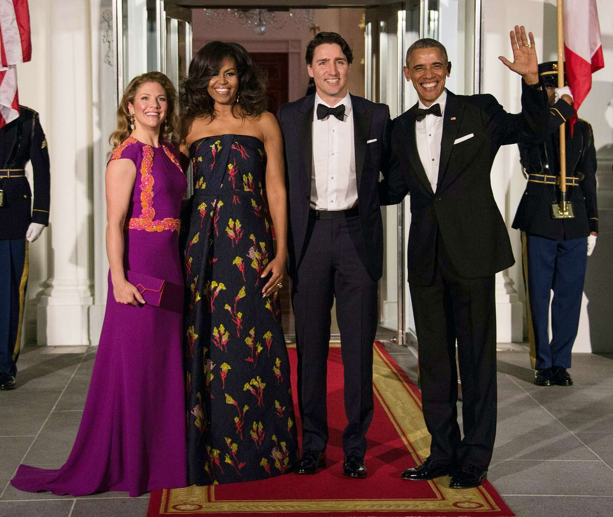 US President Barack Obama (R), Canadian Prime Minister Justin Trudeau (2nd R) and their wives Michelle Obama (2nd L) and Sophie Gregoire Trudeau (L) pose u[pon the Trudeau's arrival for a State Dinner in their honor at the White House in Washington, DC, o