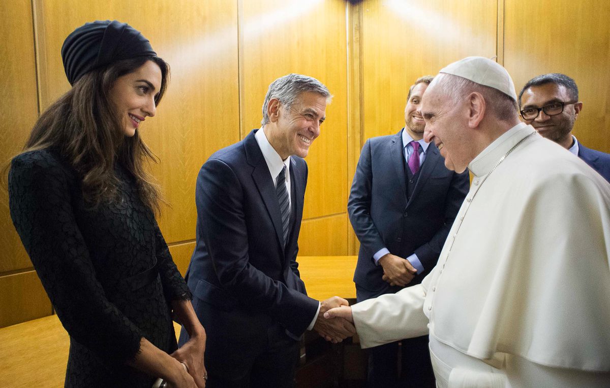 Pope Francis meets actor George Clooney and his wife Amal, at a meeting with the Scholas Occurrentes, an educational organization founded by Pope Francis, at the Vatican, Sunday, May 29, 2016.