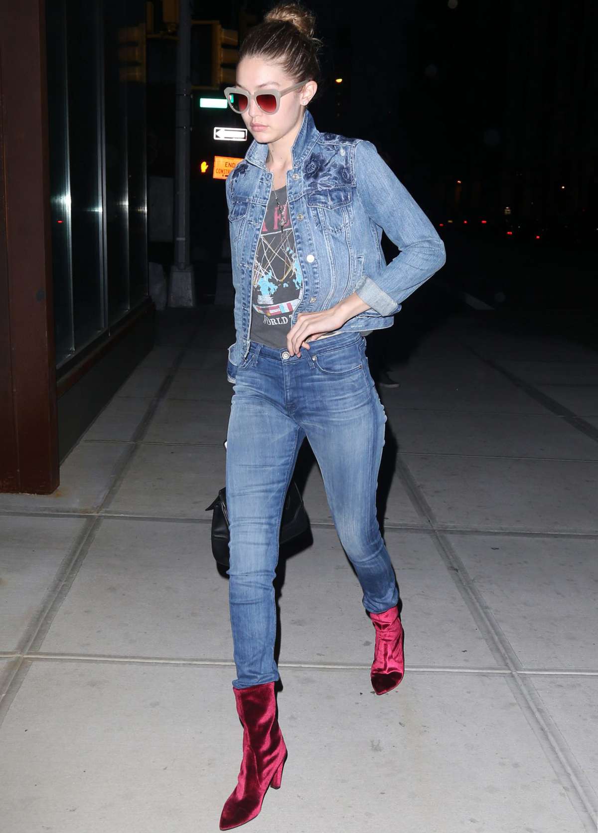 Model Gigi Hadid out and about in New York City, New York on June 16, 2016. She wore a jean jacket with matching jeans and bright red boots. Gigi and one of her best friends Kylie Jenner were criticized by a model, who stated that they were not considered