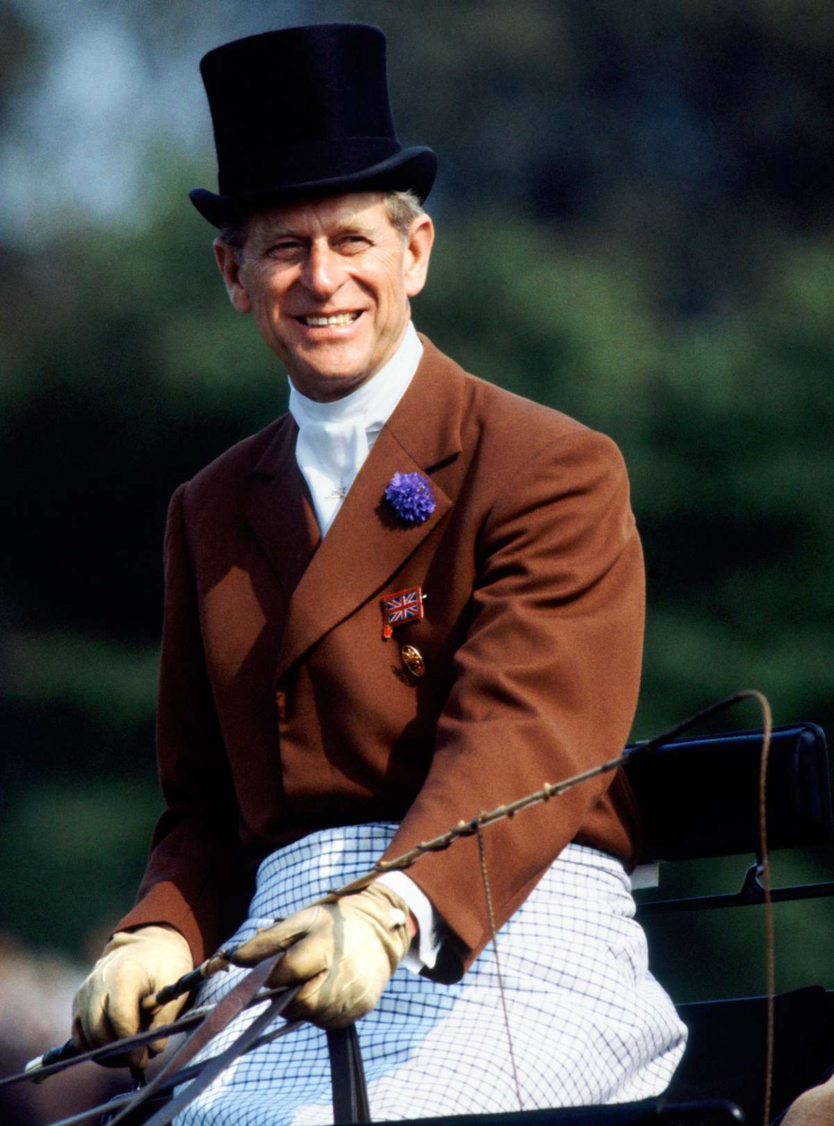 Prince Philip Drives a Horse Carriage