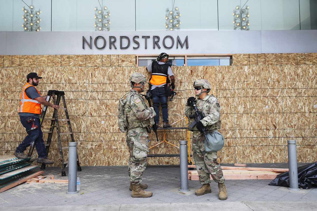 Nordstrom is boarded up between protests to avoid looting.