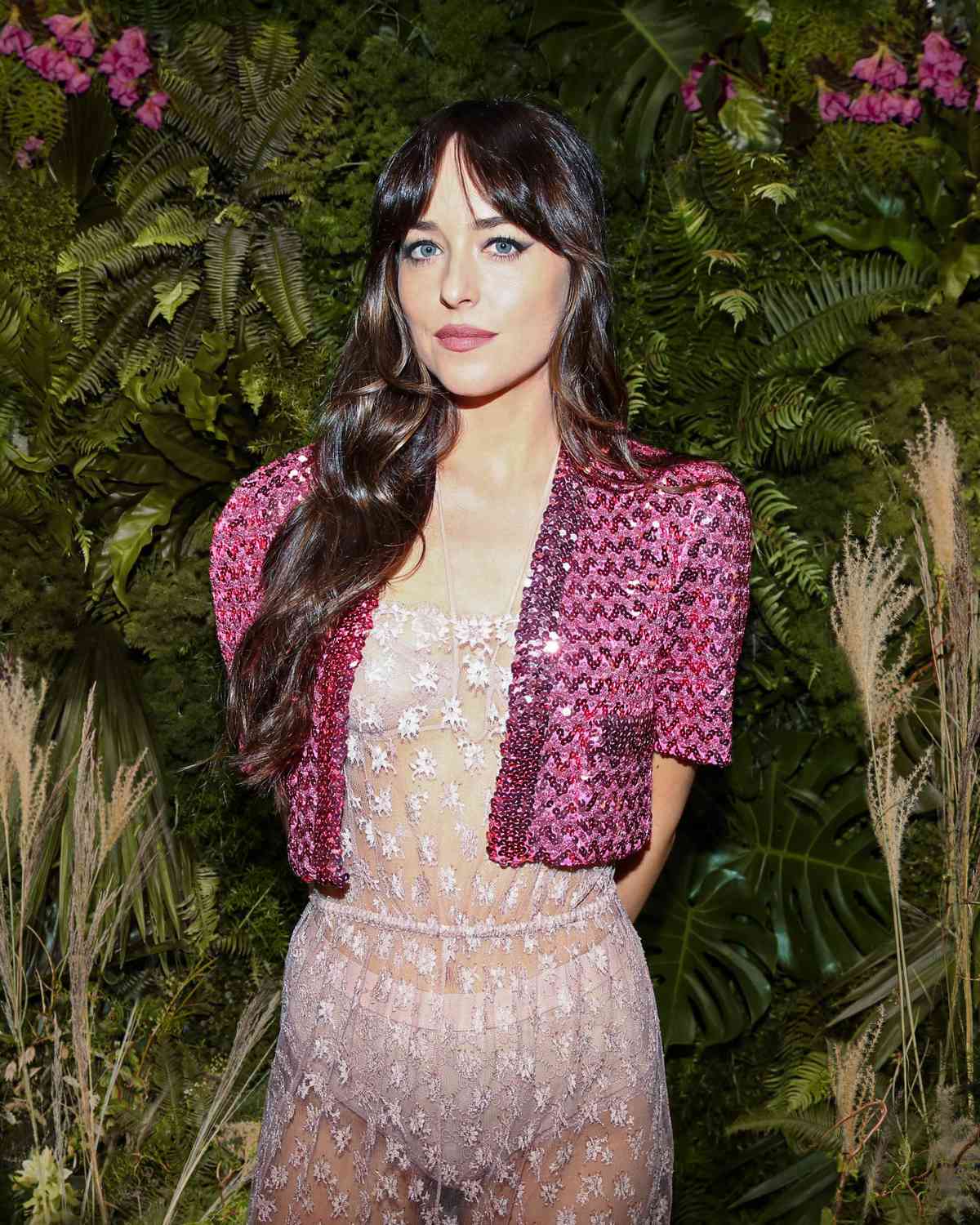 Dakota Johnson Wore a Sheer Lace Jumpsuit With a Sequined Shrug
