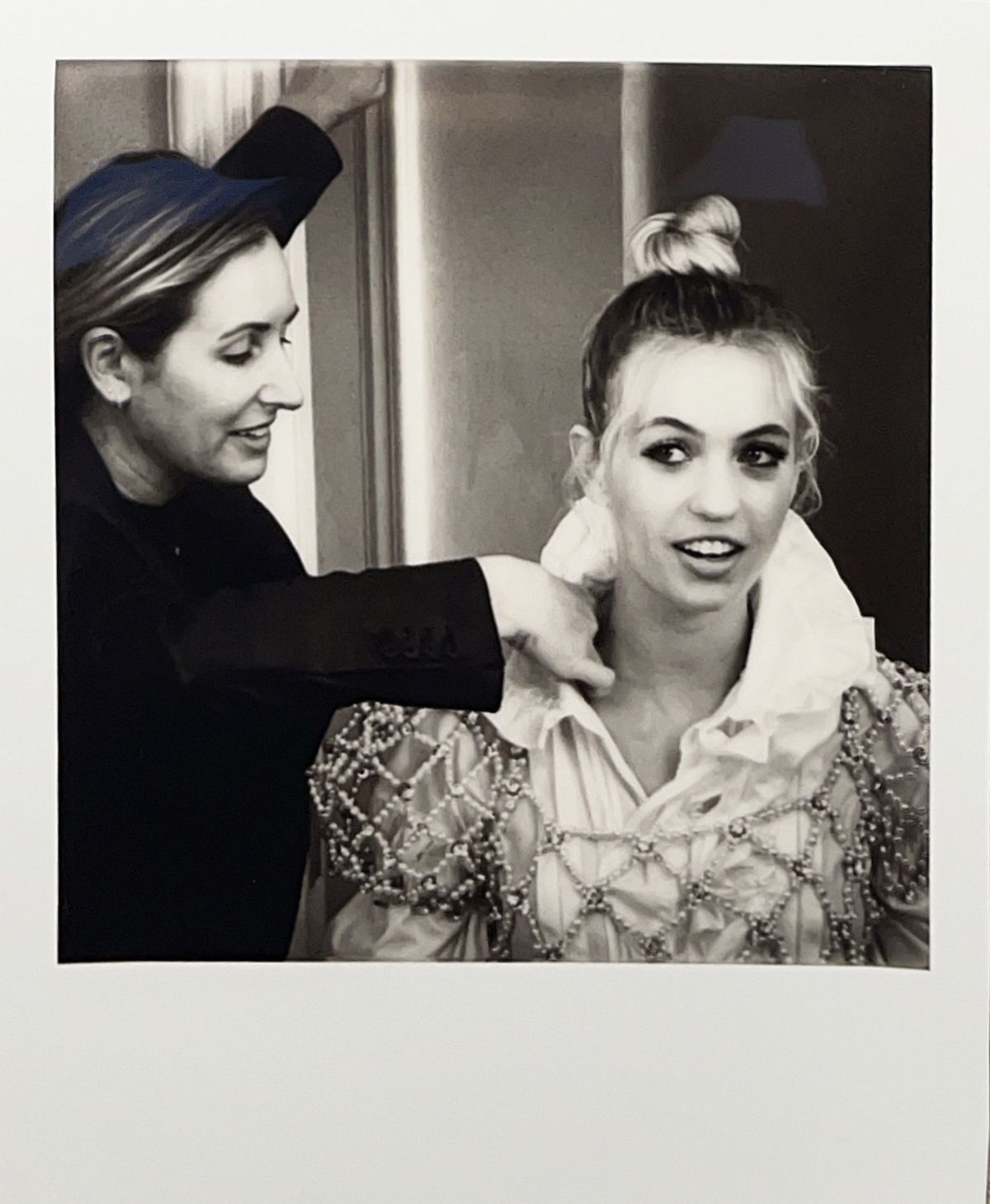<p>"This is my incredible stylist Erica Cloud sewing me into my dress. A very underrated part of styling."</p>
                            