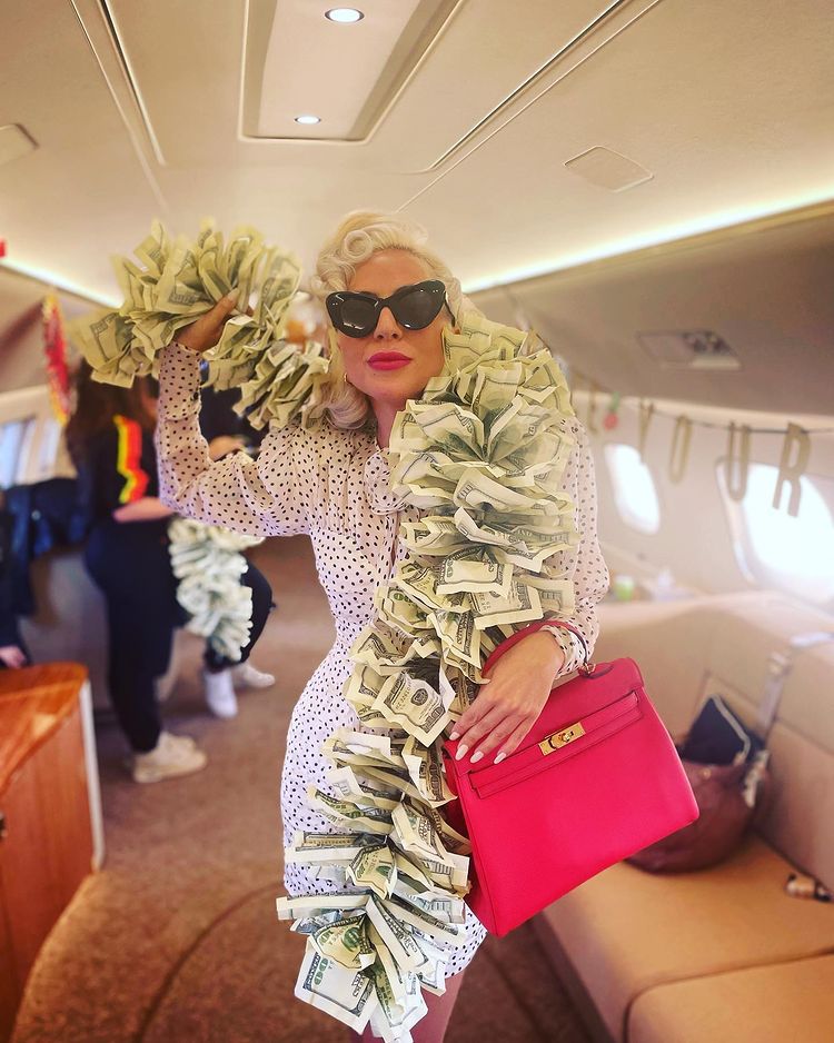 Lady Gaga Paired a Boa Made of $100 Bills With a Birkin Bag