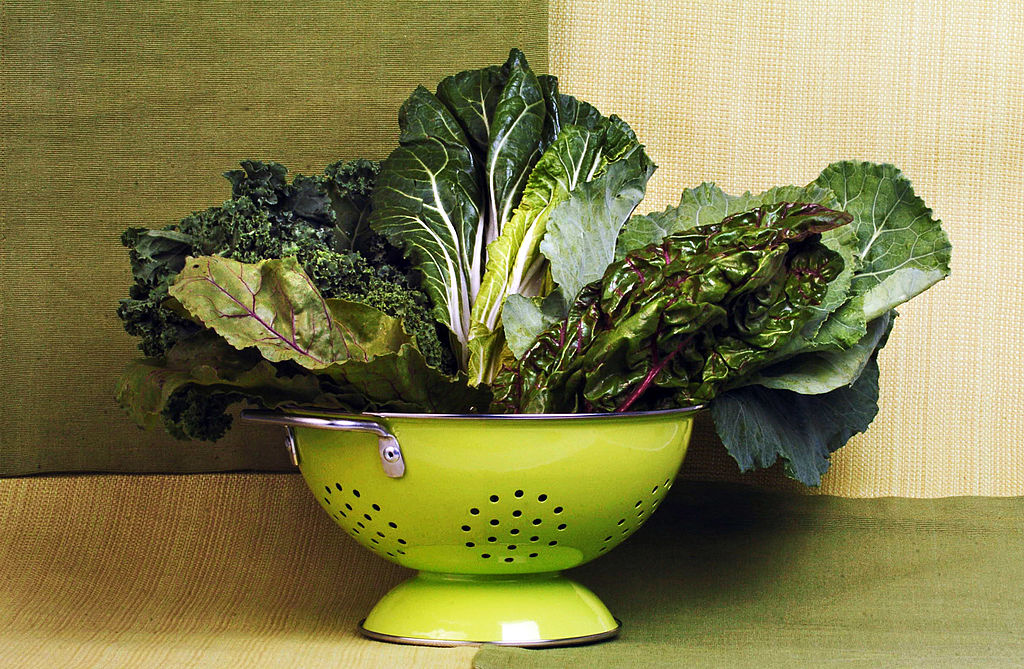 colander filled with leafy greens