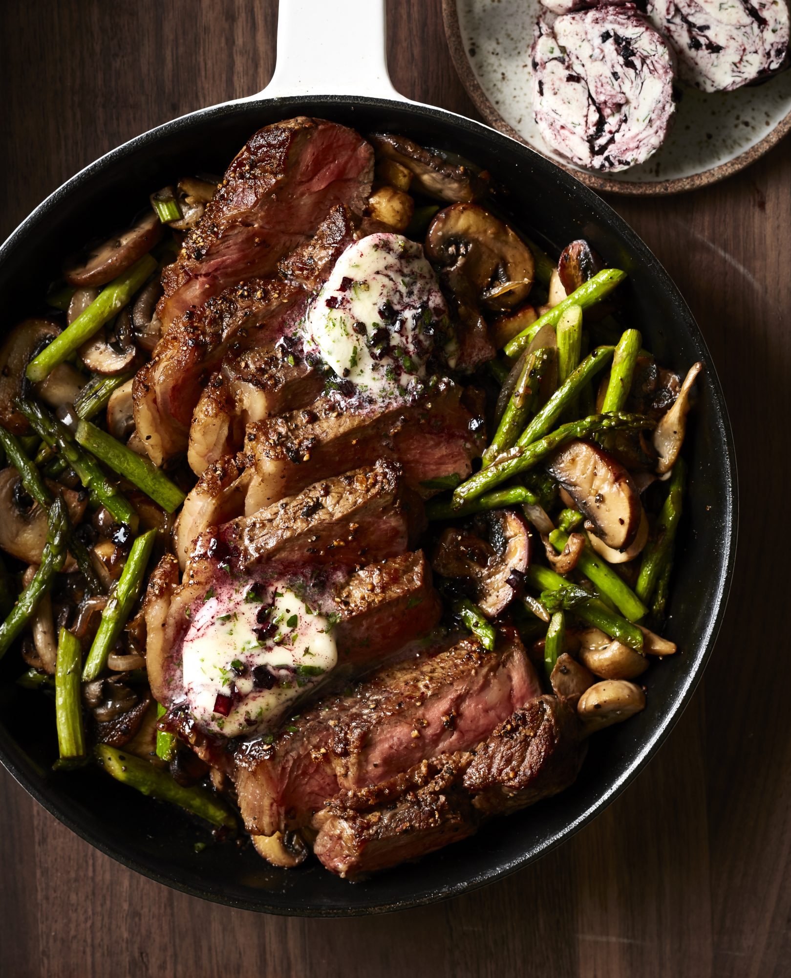Pan-Seared Strip Steak with Mushrooms, Asparagus, and Vanilla-Cabernet Butter image