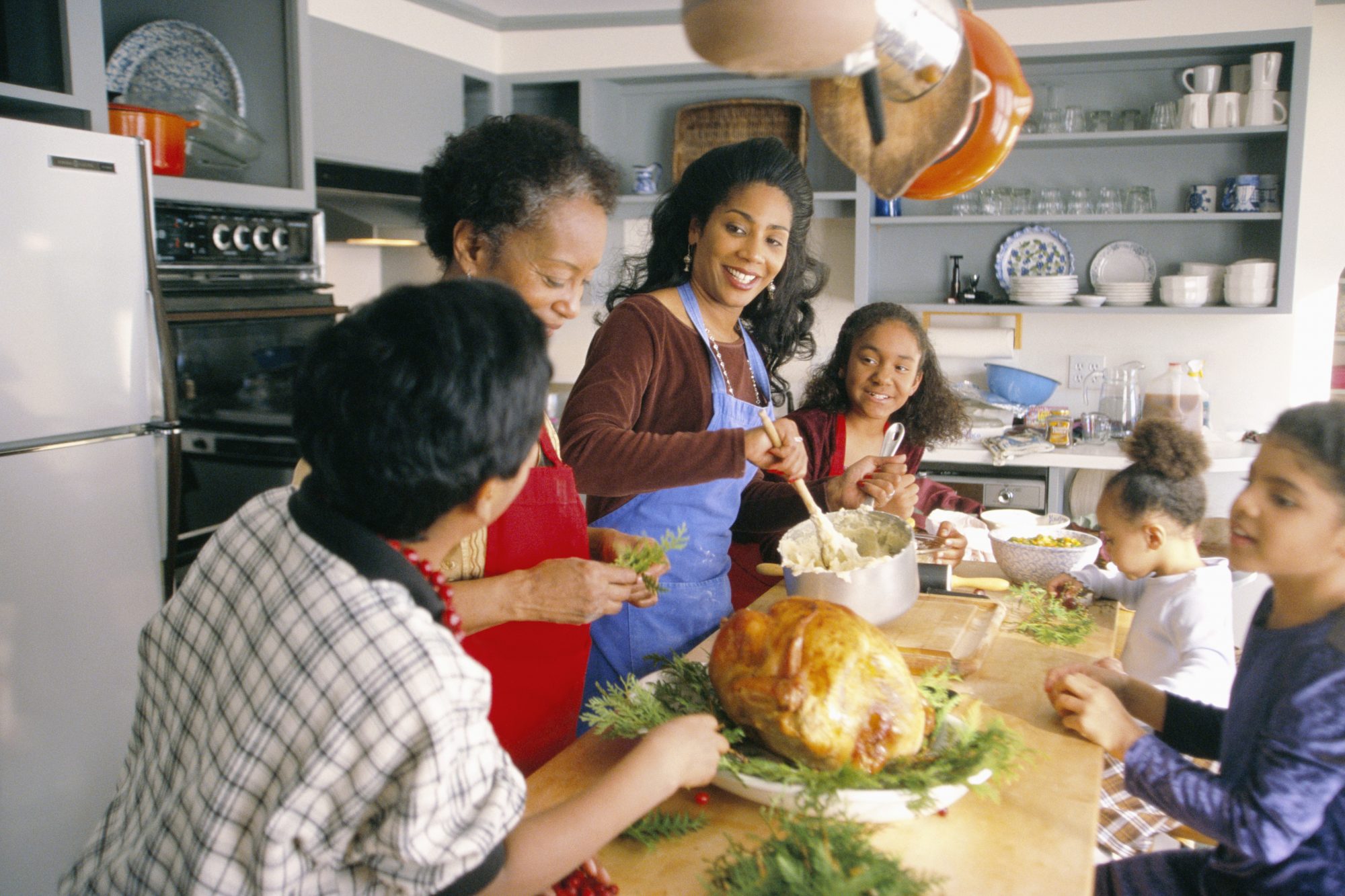 getty family preparing holiday dinner in the kitchen image
