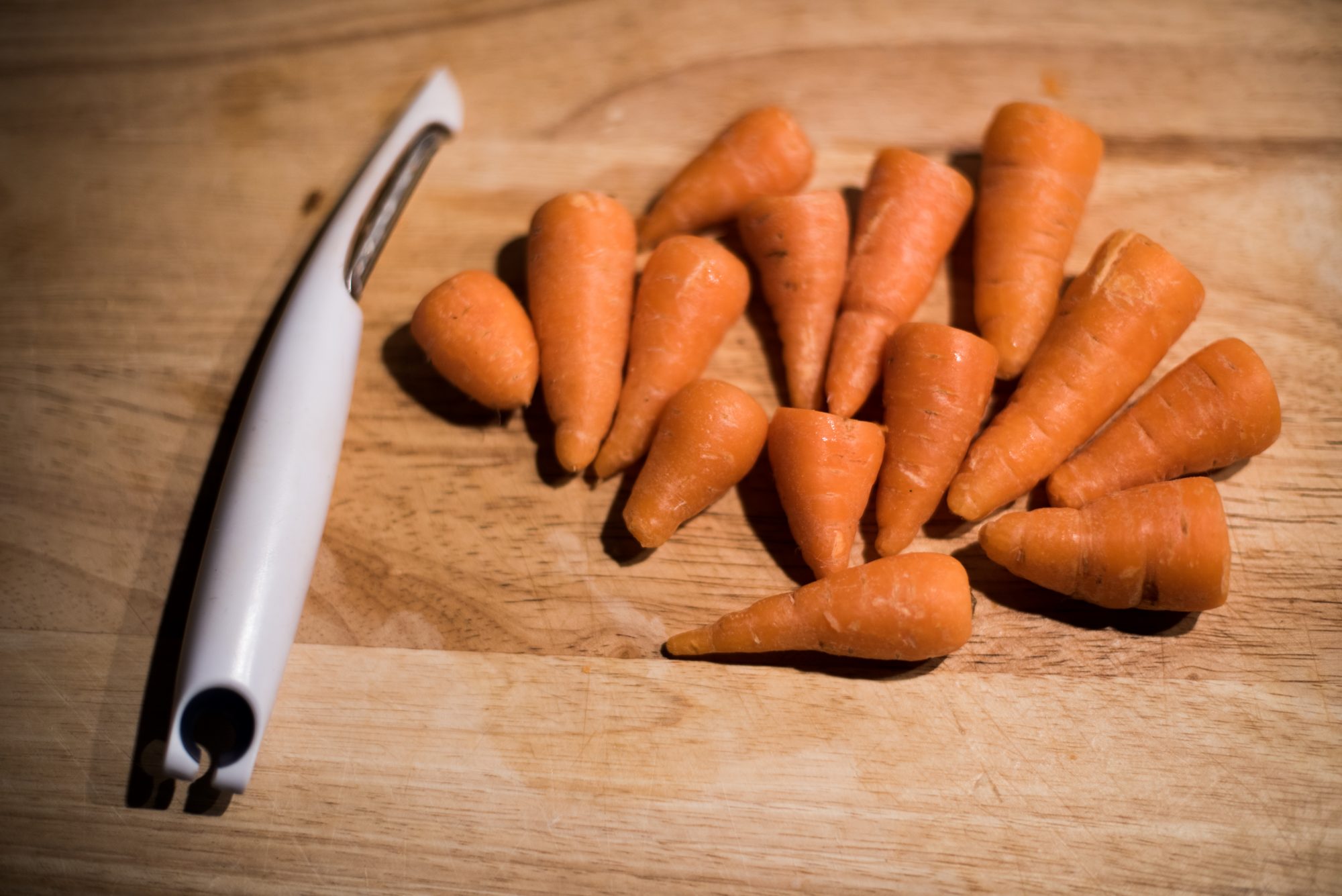 baby carrots on cutting board