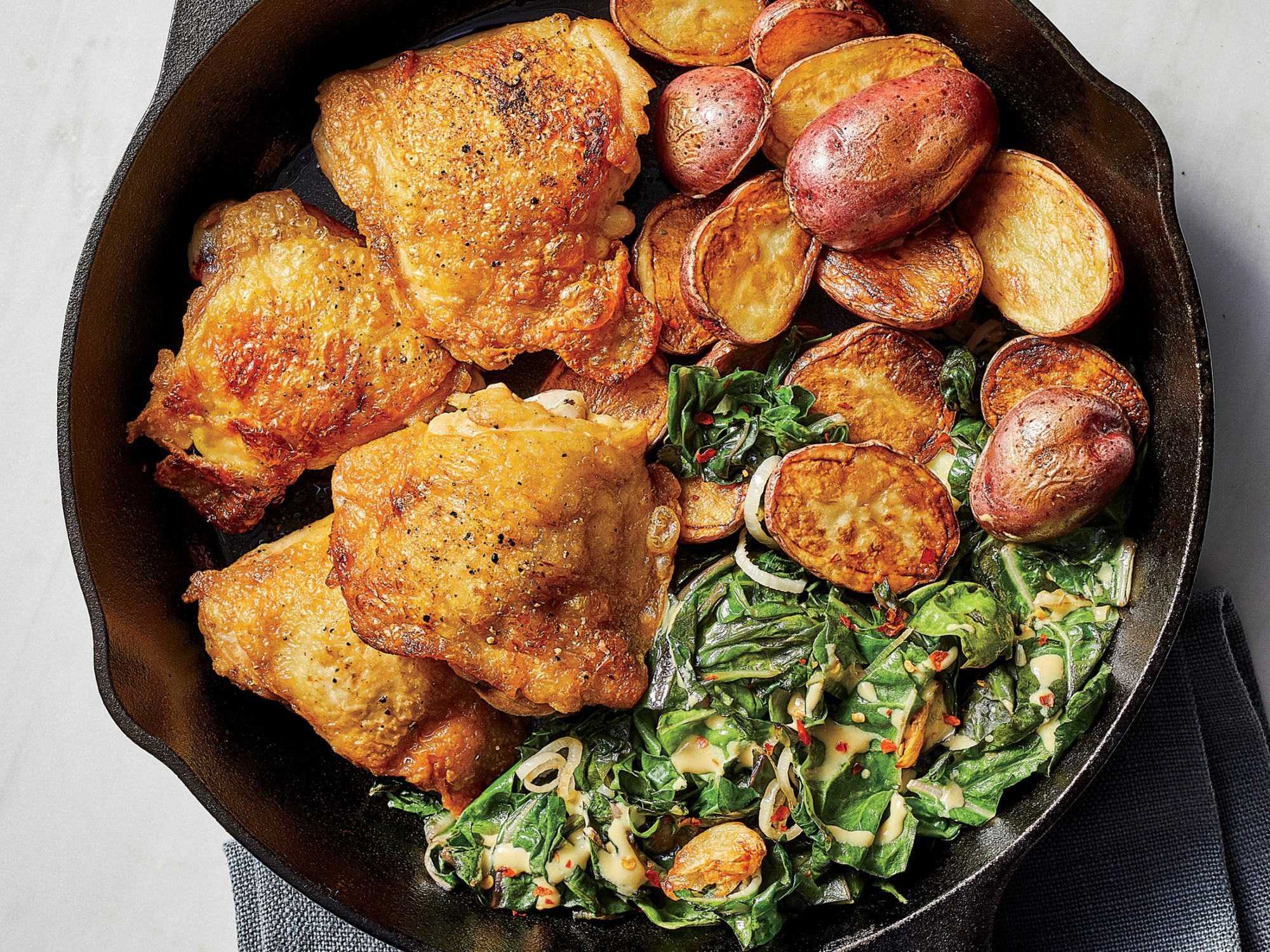 Extra-Crispy Chicken Thighs with Potatoes and Chard