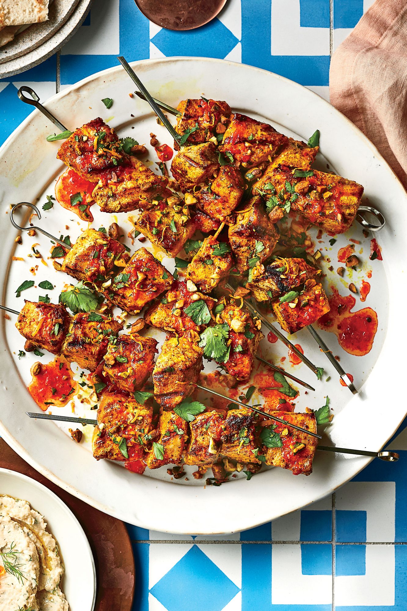 Turmeric-Marinated Swordfish Skewers with Harissa and Pistachios