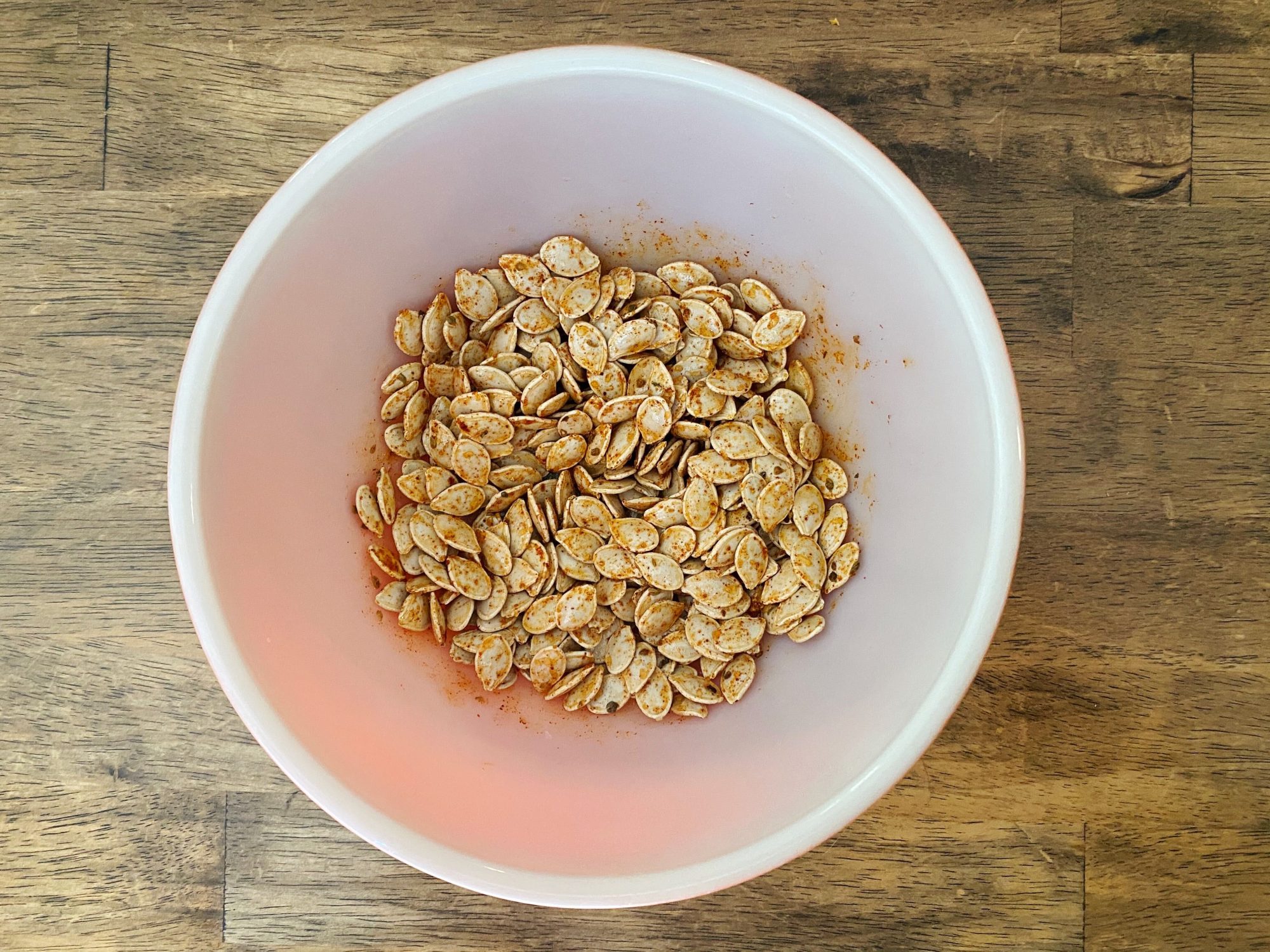 Seasoned pumpkin seeds in bowl