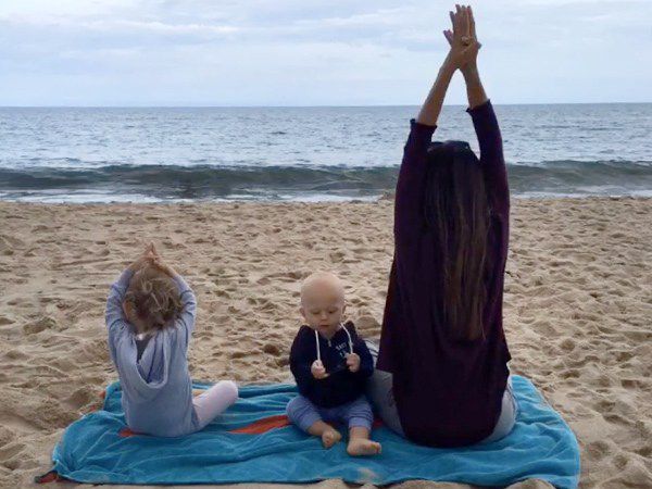 Hilaria Baldwin kids beach yoga