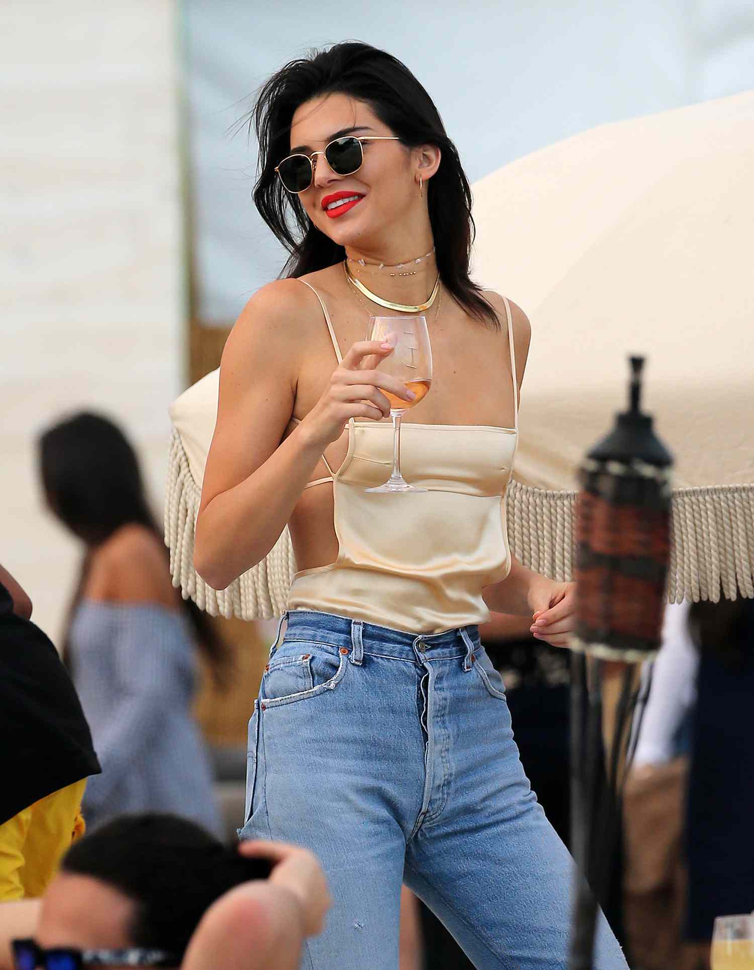 Kendall Jenner Wears A Silky Backless Top As She Enjoys A Glass Of Wine On The Beach In Miami