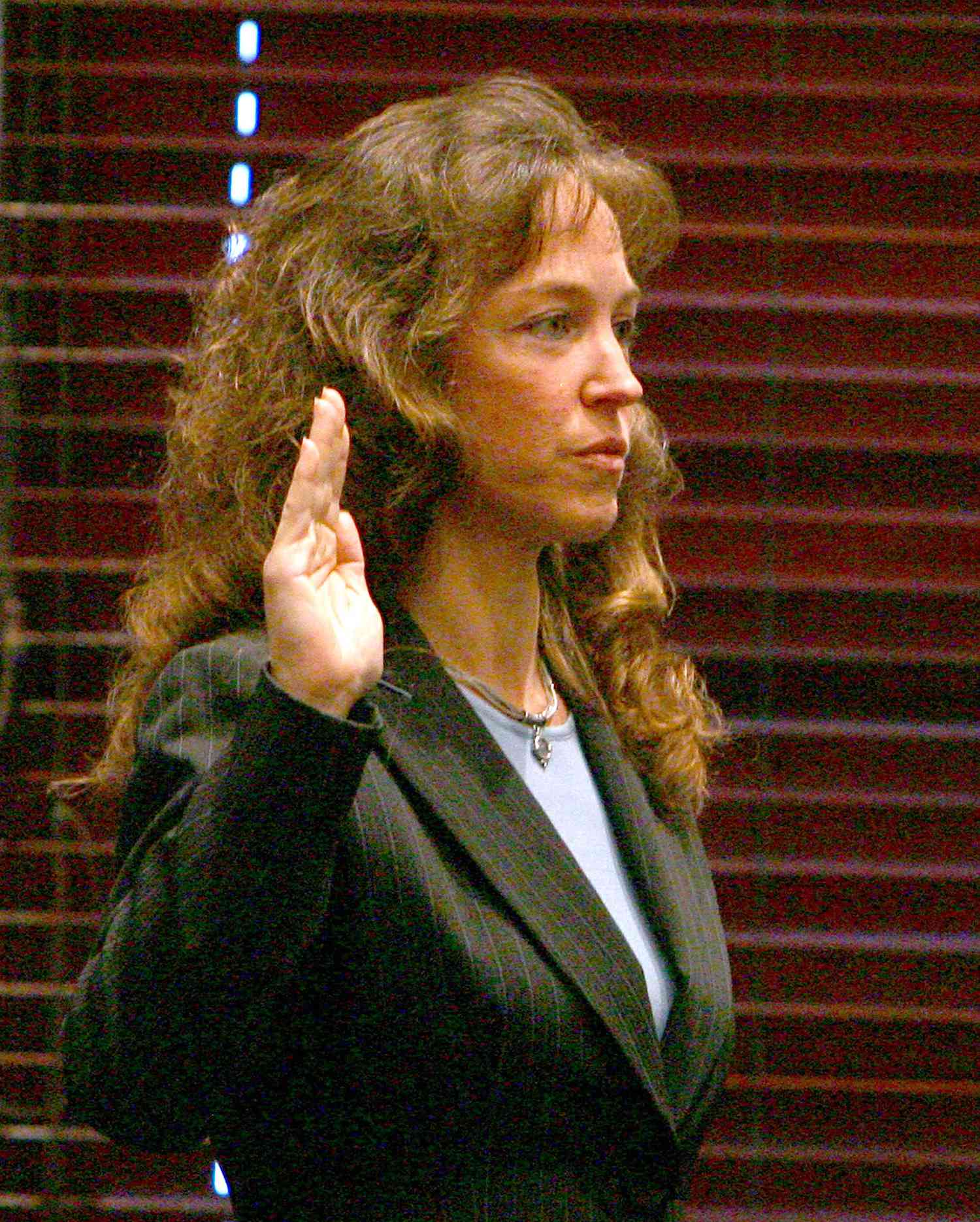 Former NASA astronaut Lisa Nowak is sworn in during a hearin