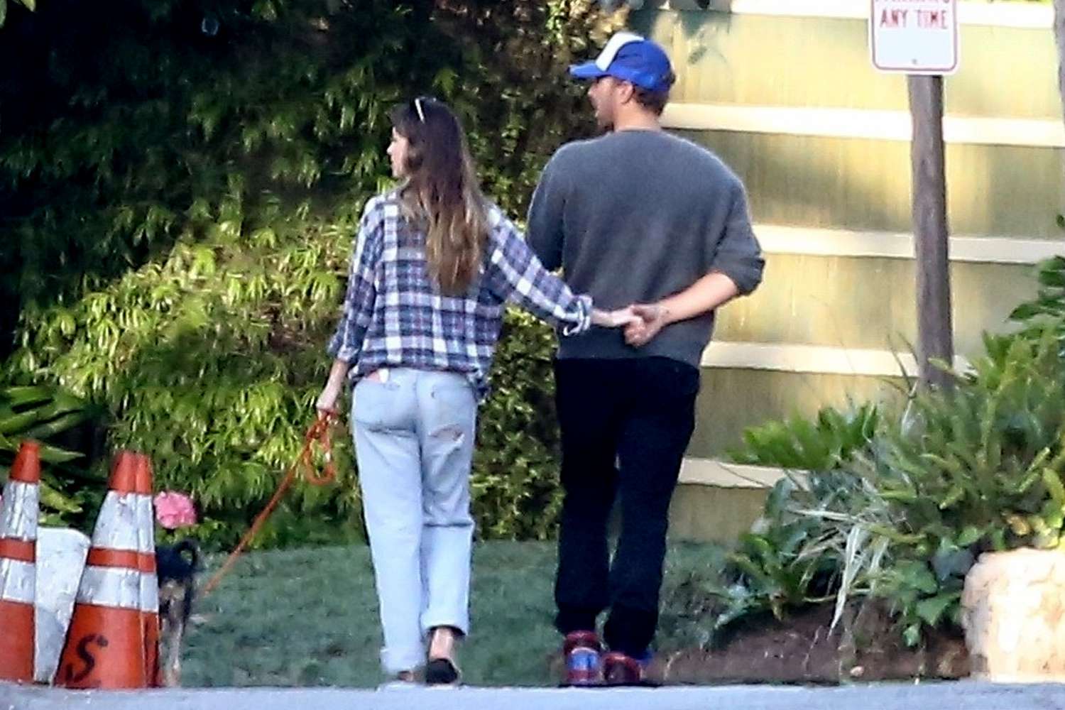 *EXCLUSIVE* Chris Martin and Dakota Johnson show some sweet PDA while ending the weekend with a stroll