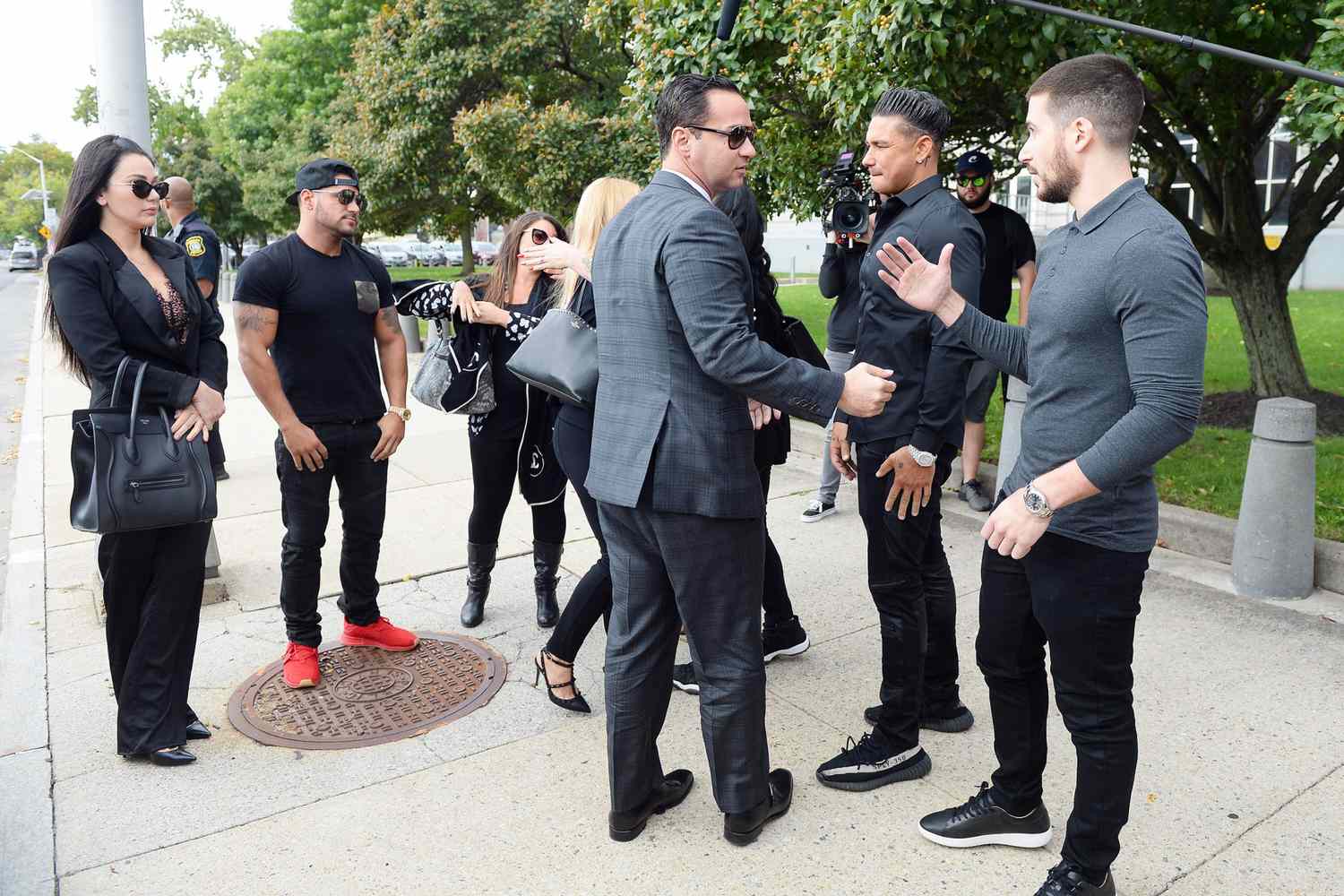 (Jersey Shore Members huging Mike (The Situation) Sorrentino photogaphed arriving at Newwark Nj court were he is to be sentenced for tax evasion