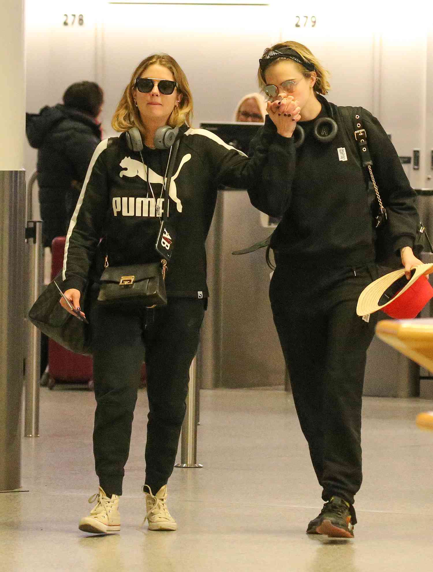 EXCLUSIVE: Cara Delevingne and girlfriend Ashley Benson Seen At Gatwick Airport