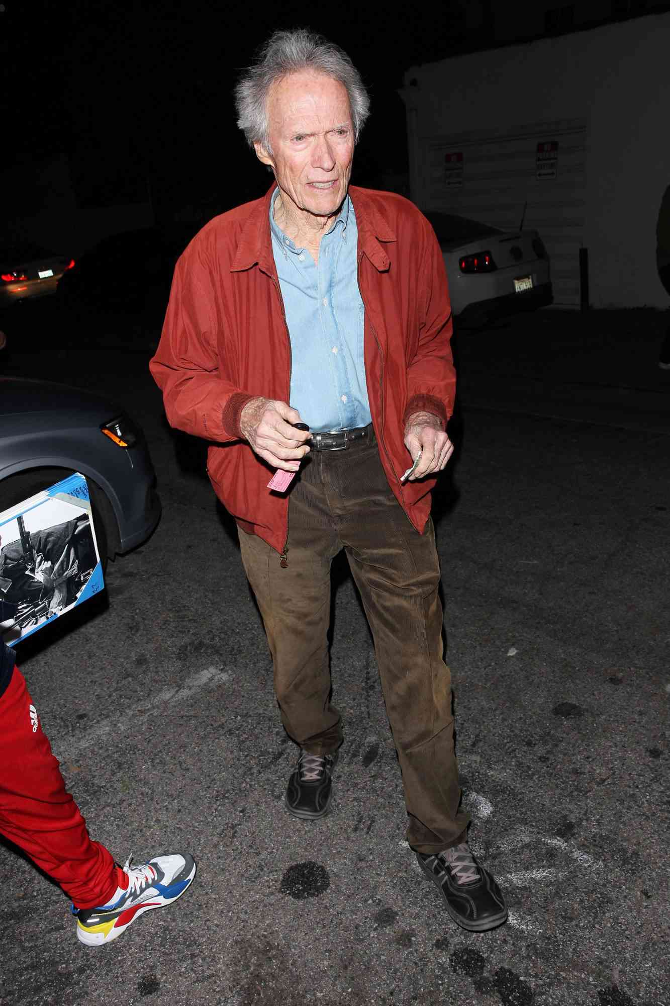 Clint Eastwood Wears A Red Jacket As He Exits From Craig's Restaurant