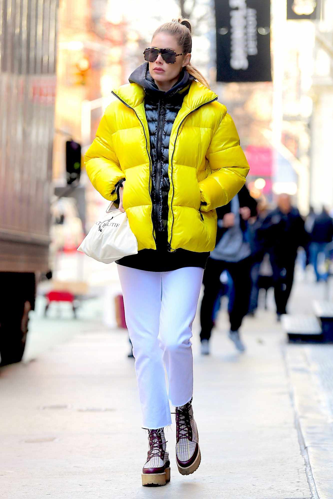 EXCLUSIVE: Doutzen Kroes Wears Bright Yellow Bubble Jacket while Shopping in Soho