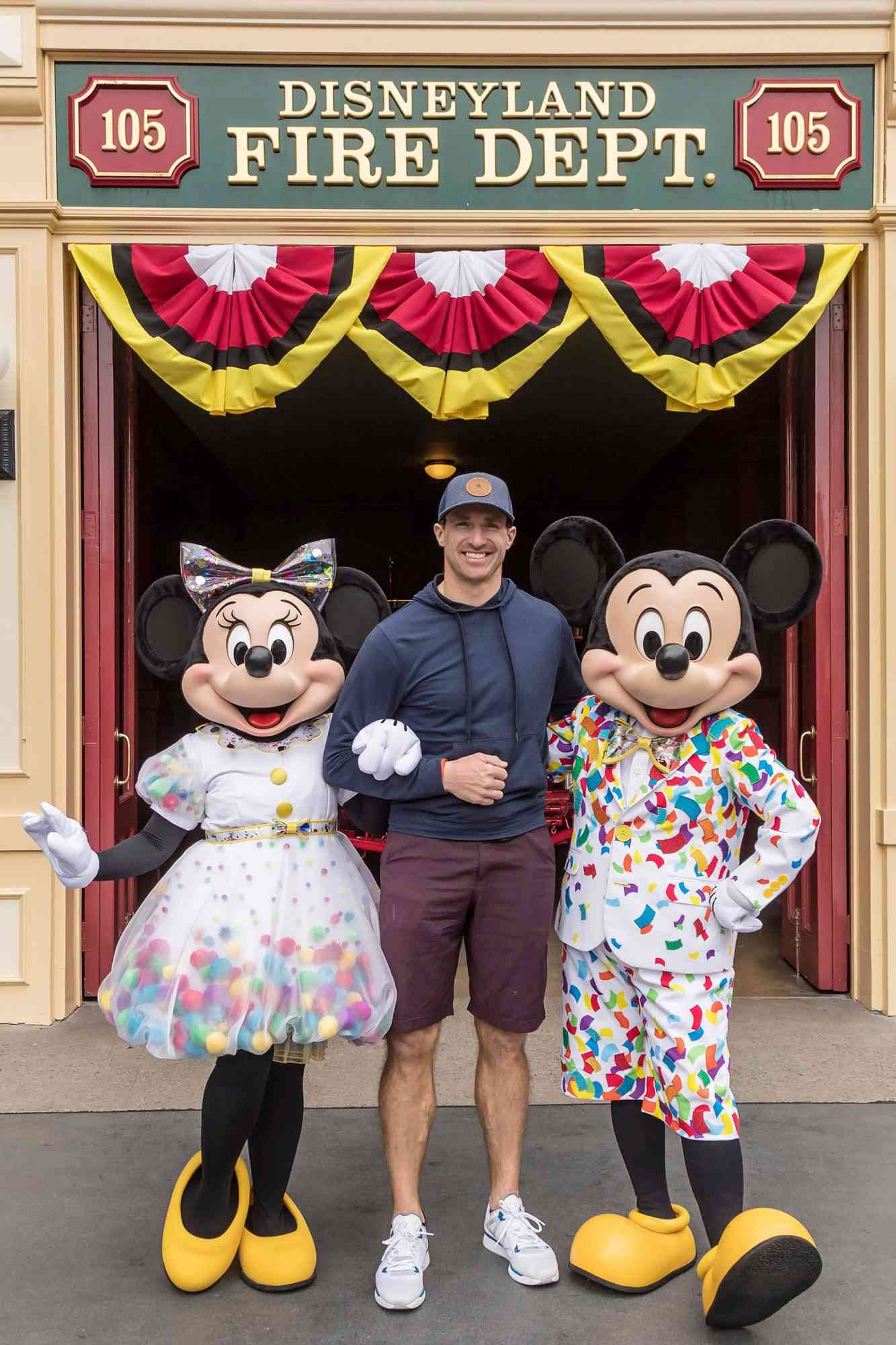 Drew Brees And Family Celebrate Vacation With Mickey Mouse And Minnie Mouse At Disneyland Park