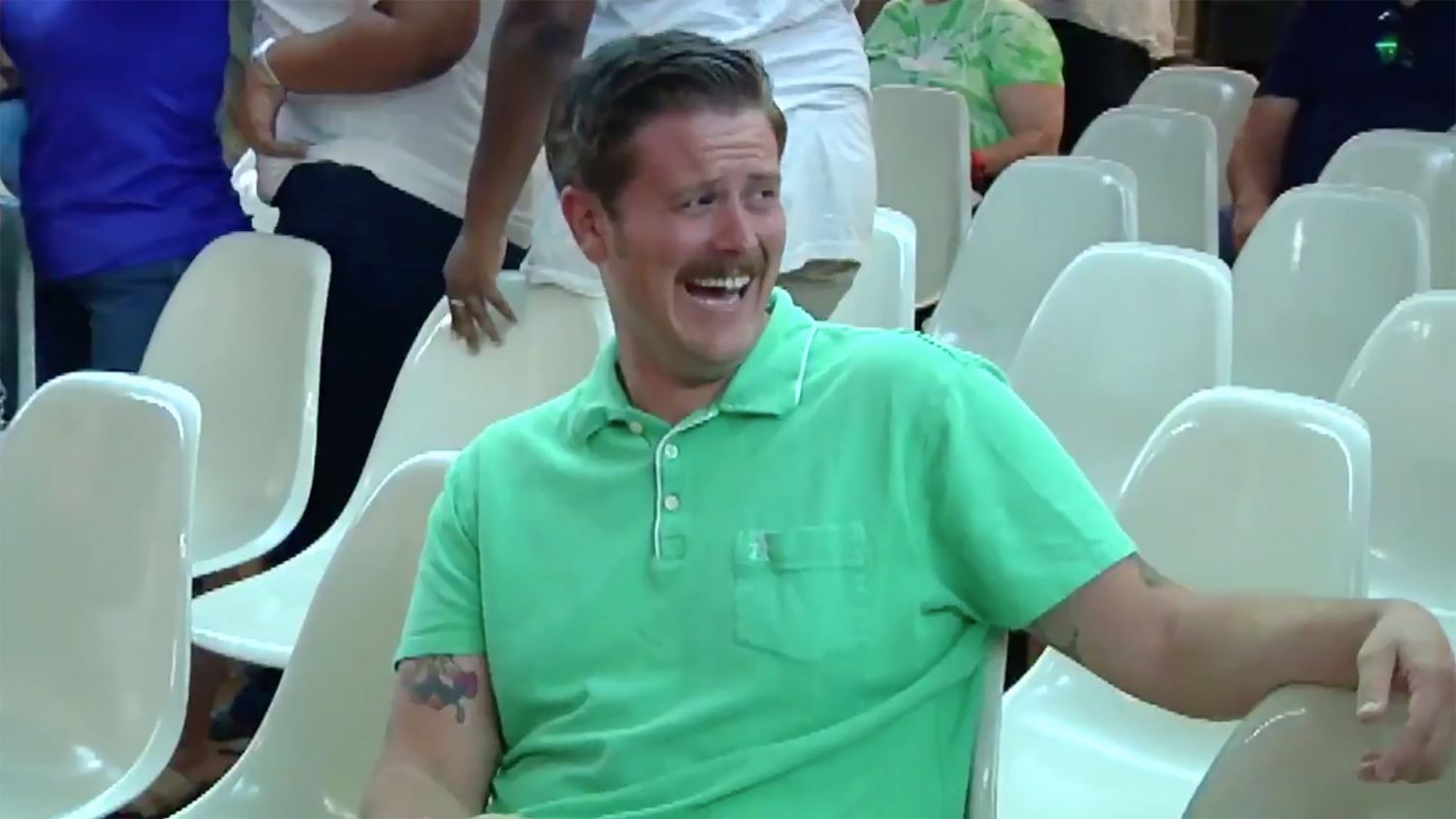 Man in green shirt laughs at pro-trump protesters at Tuscon City Council meeting