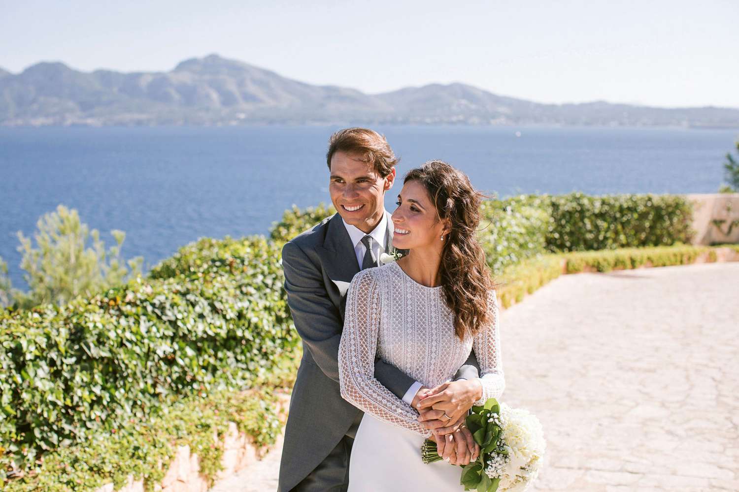 <p>The tennis star and Perell&oacute; got married on Oct. 19 on Mallorca, a Spanish island in the Mediterranean and Nadal's hometown, according to AFP.</p>
                            <p>Wearing a gown designed by Rosa Clar&aacute;, the bride served up sheer elegance to match the newlyweds' picturesque big day. Perell&oacute;, in photos shared on the designer's official Instagram, can be seen in a long-sleeved dress, which includes a jeweled neckline, floral motifs, and microbeads on hand-embroidered fabric.</p>
                            <p>"The whole process was full of emotions between all of us," Clar&aacute; captioned a video showcasing the outfit's creation process. "We just want to thank the whole family for trusting in us, you're extraordinary."</p>
                            <p>Nadal and Perell&oacute; were engaged in Rome, Italy, in May, according to Hola! Spain.</p>
                            <p>While the legendary athlete has kept his relationship with Perell&oacute; private, the outlet said the two have dated for about 14 years. She hails from Nadal's hometown of Mallorca, the largest island of Spain's Balearic Islands, which are in the Mediterranean.</p>
                            