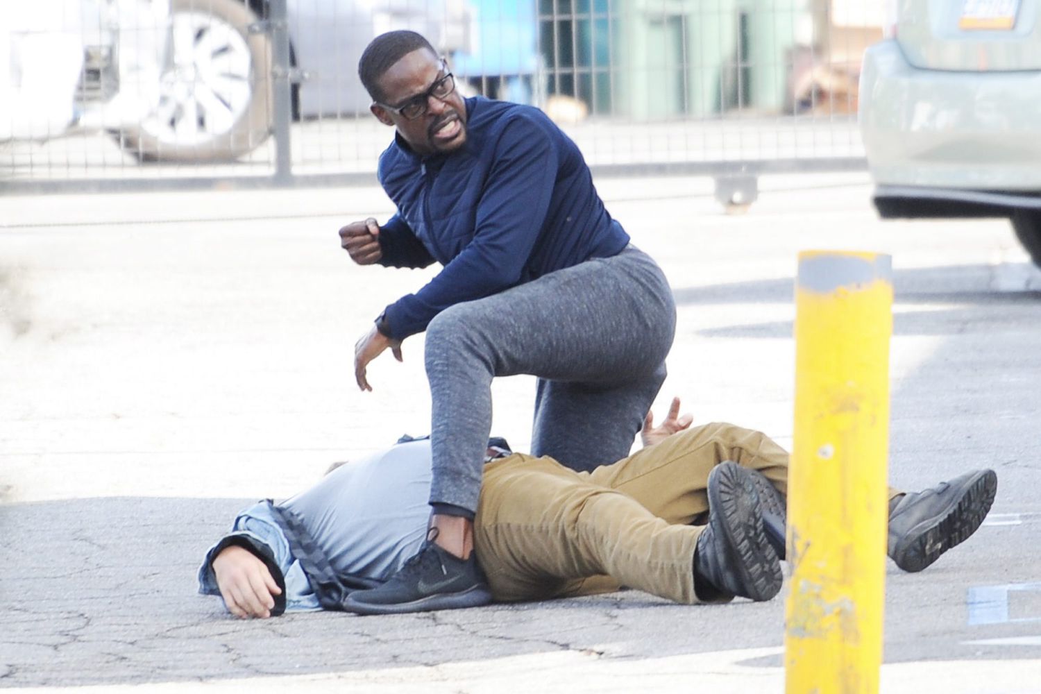Sterling Brown springs into action as he takes down a perpetrator and saves a woman from being attacked for a scene on the set of "This Is Us" filming in Highland Park, California.