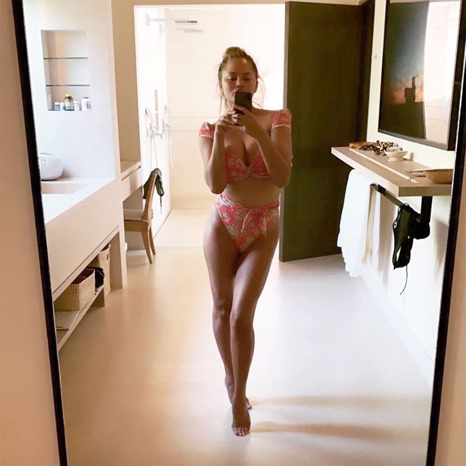 <p>Chrissy is finally wearing two-pieces again, after getting her breast implants removed, and she's not wasting any time showing them off, posing in a high-waisted Montce Swim bikini during a tropical getaway. </p>
                            