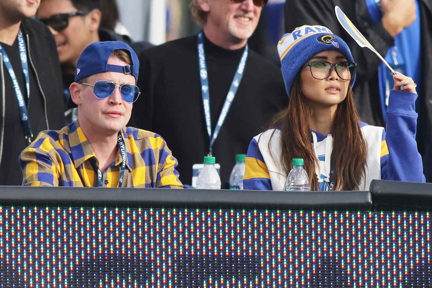 Macaulay Culkin wearing red nail polish and girlfriend Brenda Song attend the game between the Los Angeles Rams and the Arizona Cardinals at the Los Angeles Memorial Coliseum on December 29, 2019 in Los Angeles, California